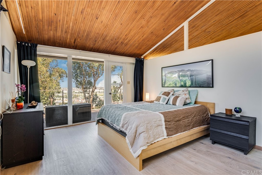4329 Vía Azalea Palos Verdes Estates, CA 90274 - Photo 15 of 31 a bedroom with a bed and a large window
