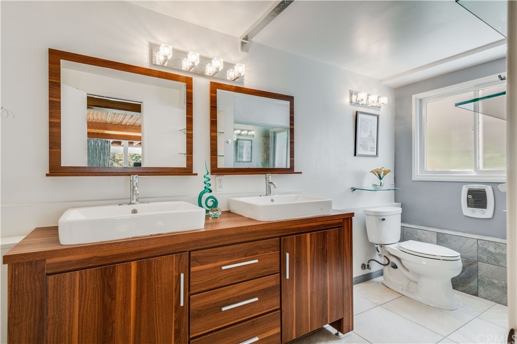 4329 Vía Azalea Palos Verdes Estates, CA 90274 - Photo 16 of 31 a bathroom with a toilet a sink and mirror
