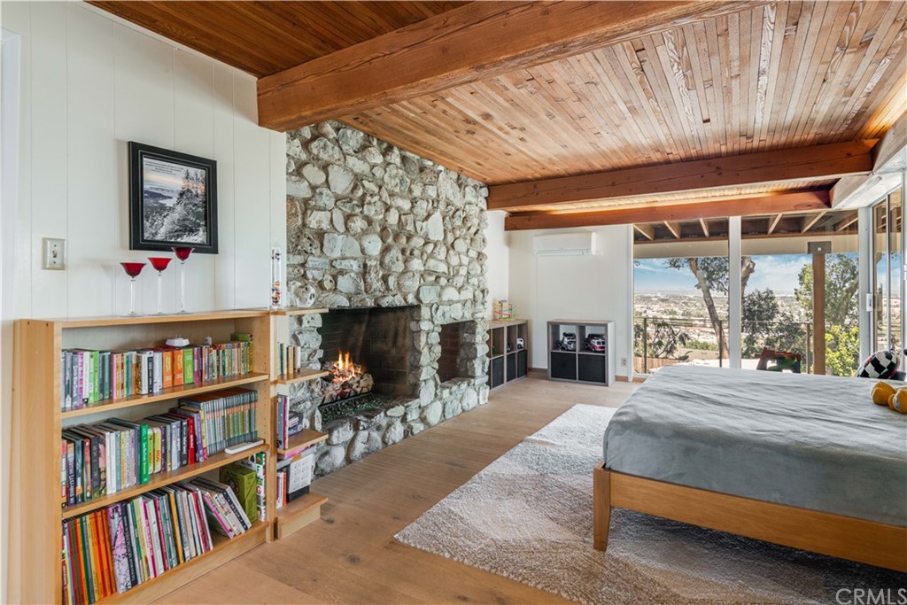 4329 Vía Azalea Palos Verdes Estates, CA 90274 - Photo 21 of 31 a bedroom with a bed a book shelf and a window