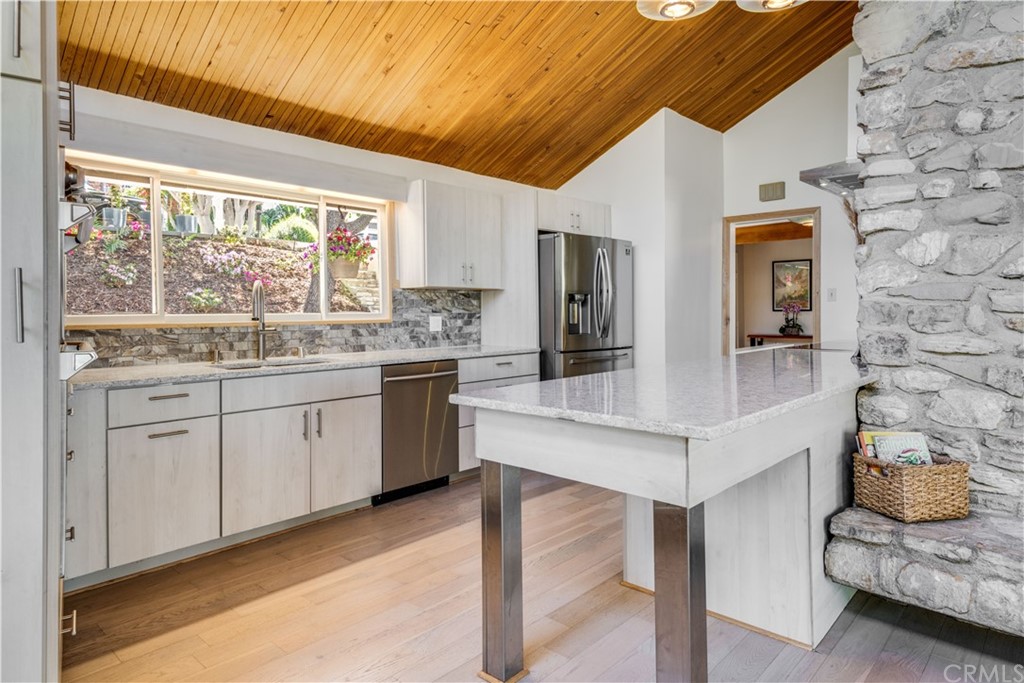 4329 Vía Azalea Palos Verdes Estates, CA 90274 - Photo 4 of 31 a kitchen with a sink cabinets and window