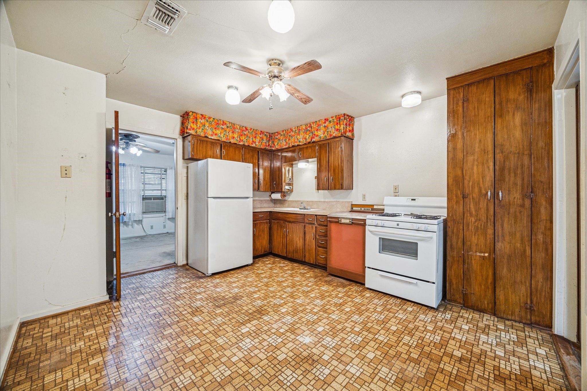 1733 Jones Street Rosenberg, TX 77471 - Photo 6 of 10 a kitchen with a refrigerator sink and cabinets