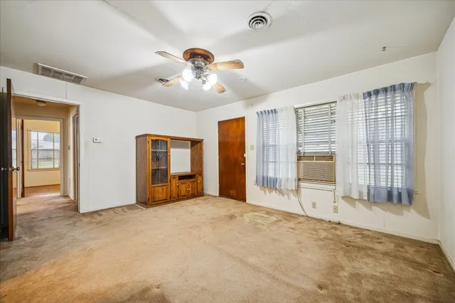 a view of an empty room with window