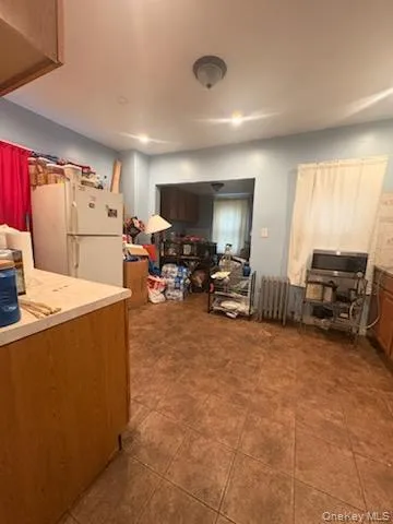 a kitchen with a refrigerator and a sink