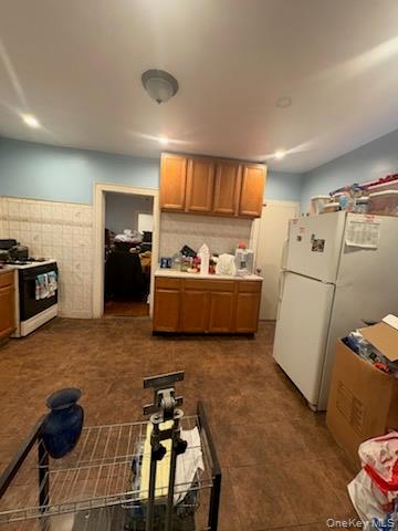 191-44 113th Road Queens, NY 11412 - Photo 13 of 31 a kitchen with a refrigerator and a sink