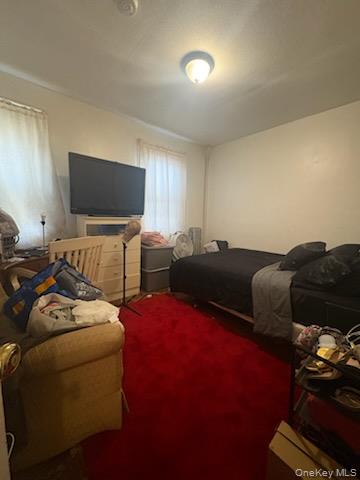 191-44 113th Road Queens, NY 11412 - Photo 18 of 31 a living room with furniture and a flat screen tv