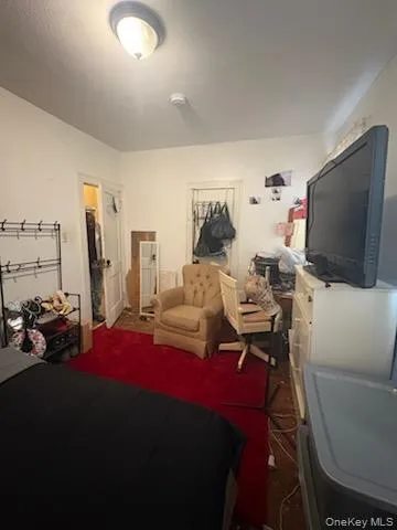 a bedroom with a bed and chair