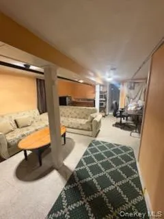 a bedroom with furniture and a mirror