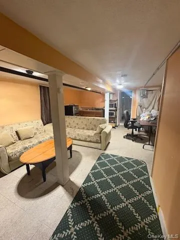 a bed sitting in a room next to a cabinet