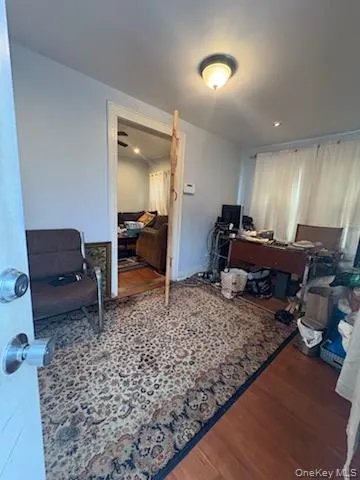 a living room with furniture rug and a table