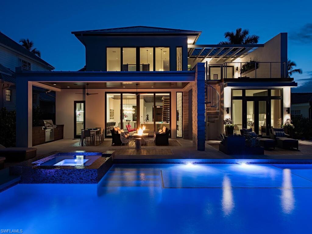 a living room with furniture pool table and a fireplace