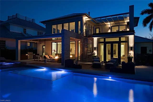 a view of a house with swimming pool and porch