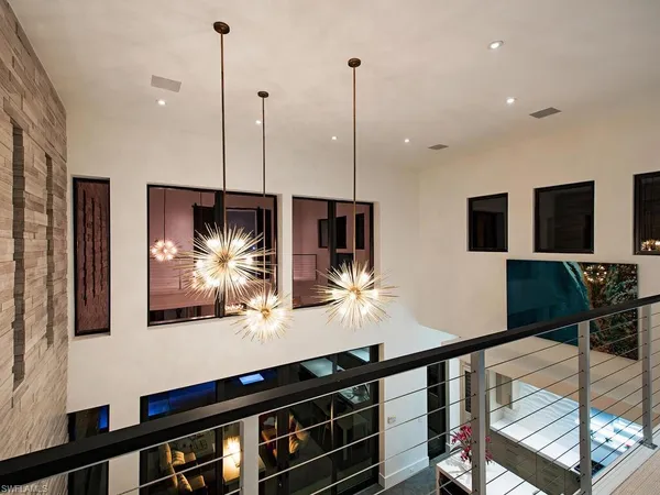 a room with lots of furniture and mirrors