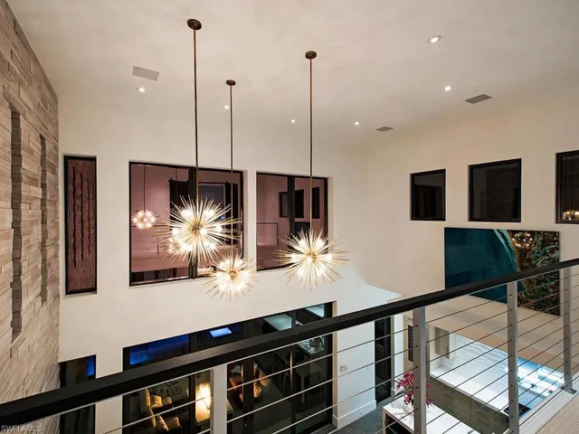 a room with lots of furniture and mirrors