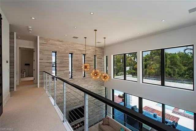 a view of a hallway with seating area