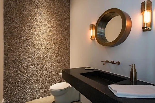 a bathroom with a toilet and a sink