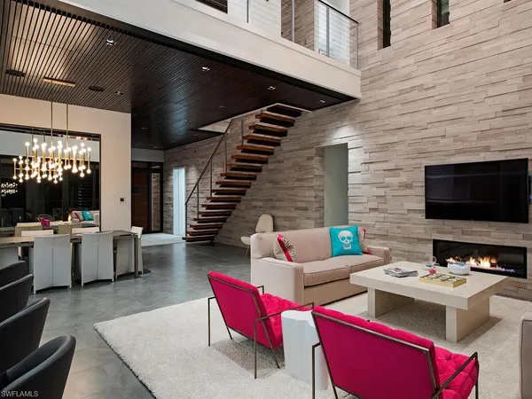 a living room with furniture and flat screen tv