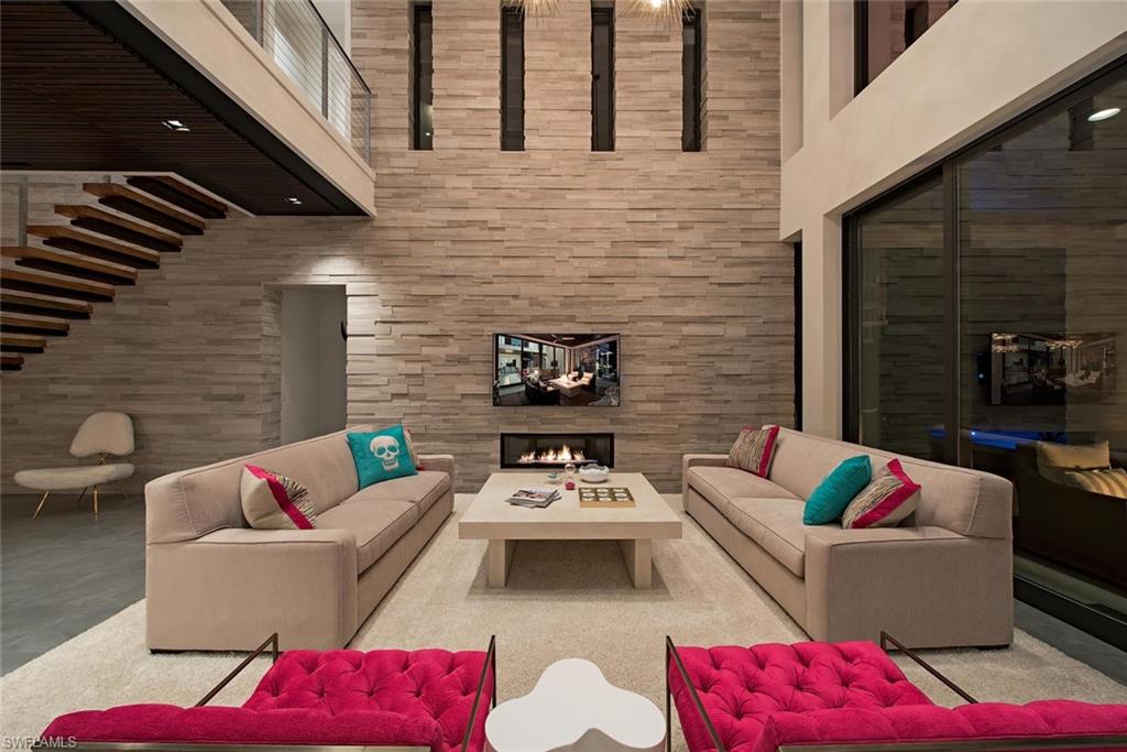 688 3rd Street North Naples, FL 34102 - Photo 8 of 33 a view of a patio with couches table and chairs