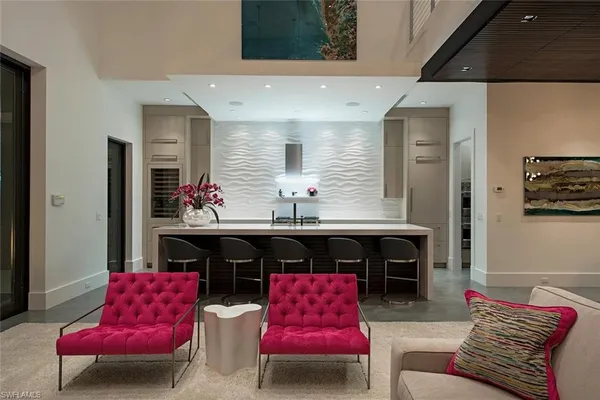 a living room with furniture fireplace and window