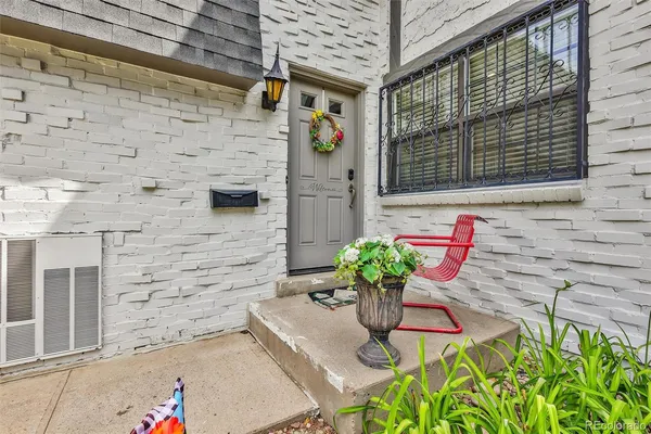 a front view of a house with an outdoor seating