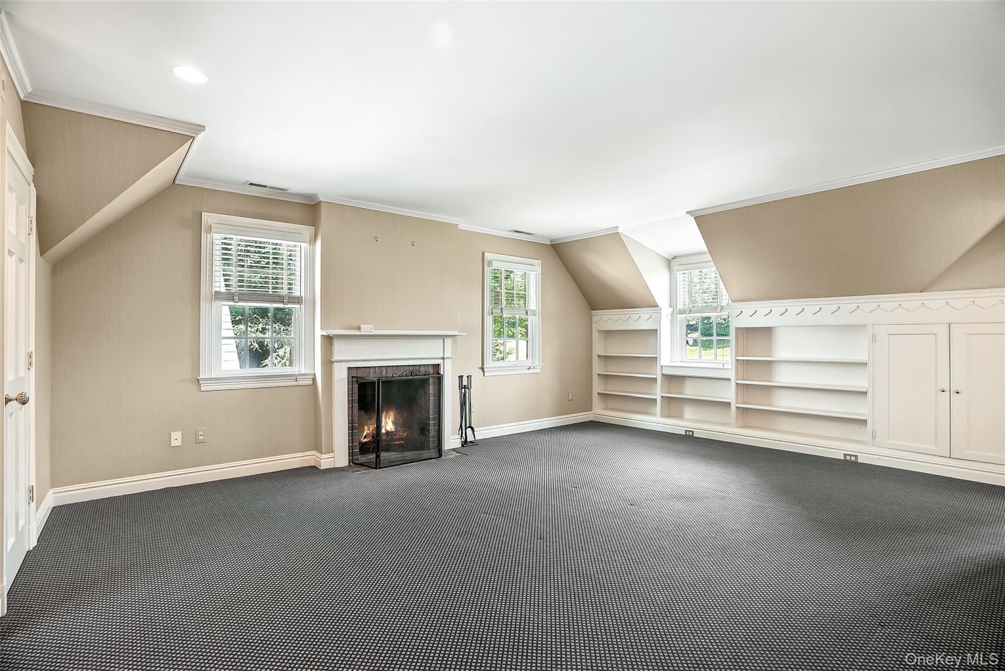 6 Club Road Rye, NY 10580 - Photo 15 of 28 an empty room with a fireplace and window