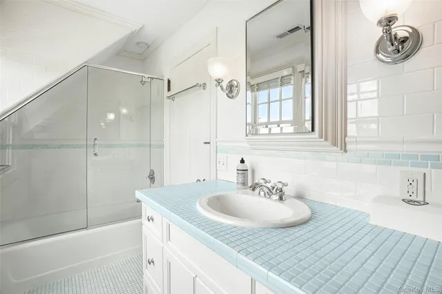 a bathroom with a sink and a mirror