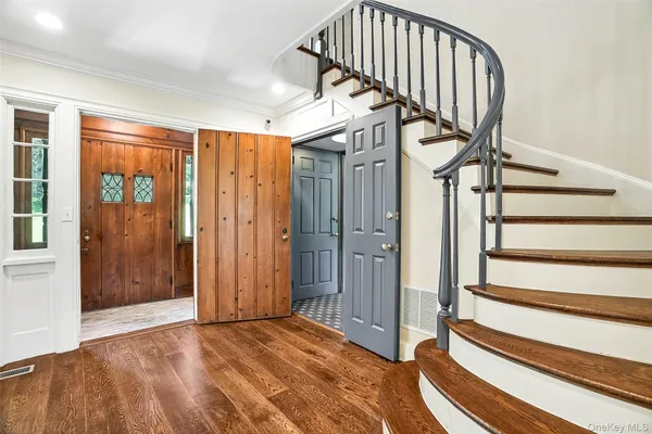 a view of entryway with wooden floor