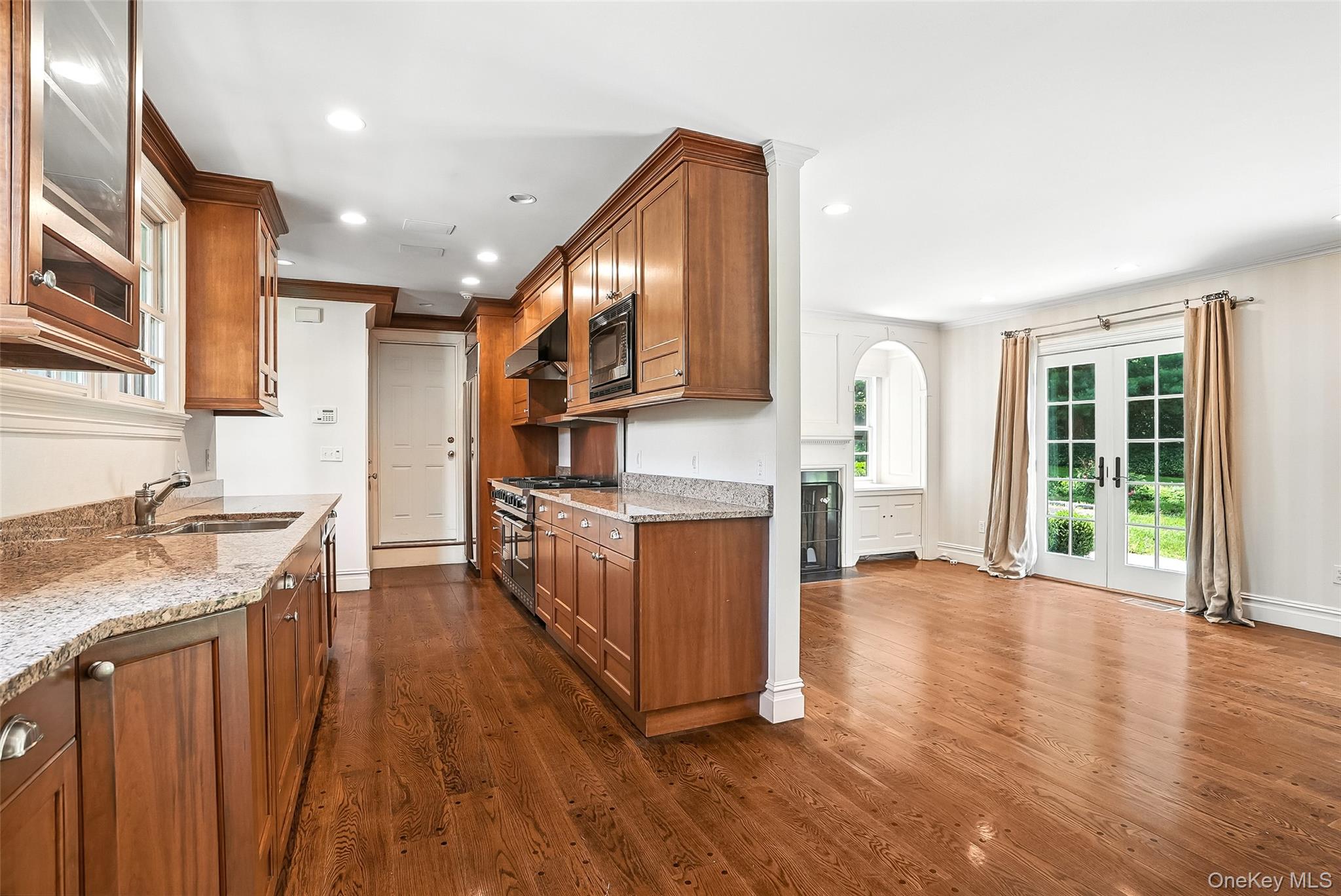 6 Club Road Rye, NY 10580 - Photo 9 of 28 a view of kitchen with stainless steel appliances granite countertop a stove top oven a sink and a refrigerator