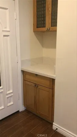 a view of a kitchen with wooden floor
