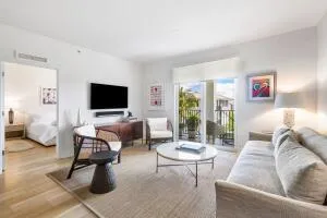 a living room with furniture and a floor to ceiling window