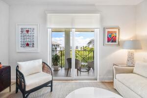 250 Northeast 3rd Avenue, Unit 1510 Delray Beach, FL 33444 - Photo 14 of 50 a living room with furniture and a floor to ceiling window
