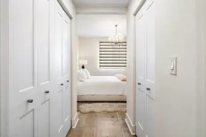 a view of a bedroom with a bed and a window