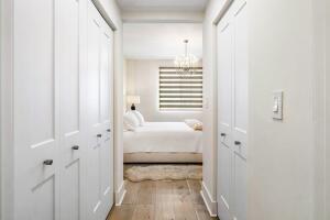 250 Northeast 3rd Avenue, Unit 1510 Delray Beach, FL 33444 - Photo 22 of 50 a view of a bedroom with a bed and a window