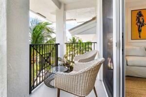 250 Northeast 3rd Avenue, Unit 1510 Delray Beach, FL 33444 - Photo 28 of 50 a balcony with furniture