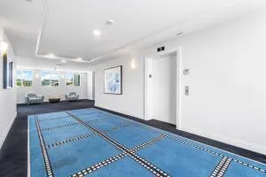 a living room with furniture and a rug