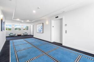 250 Northeast 3rd Avenue, Unit 1510 Delray Beach, FL 33444 - Photo 5 of 50 a living room with furniture and a rug