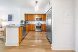 a kitchen with stainless steel appliances granite countertop a sink and cabinets