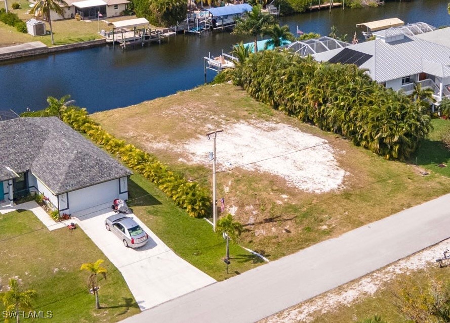 3267 Franzone Road St. James City, FL 33956 - Photo 4 of 17 a view of a swimming pool with a yard