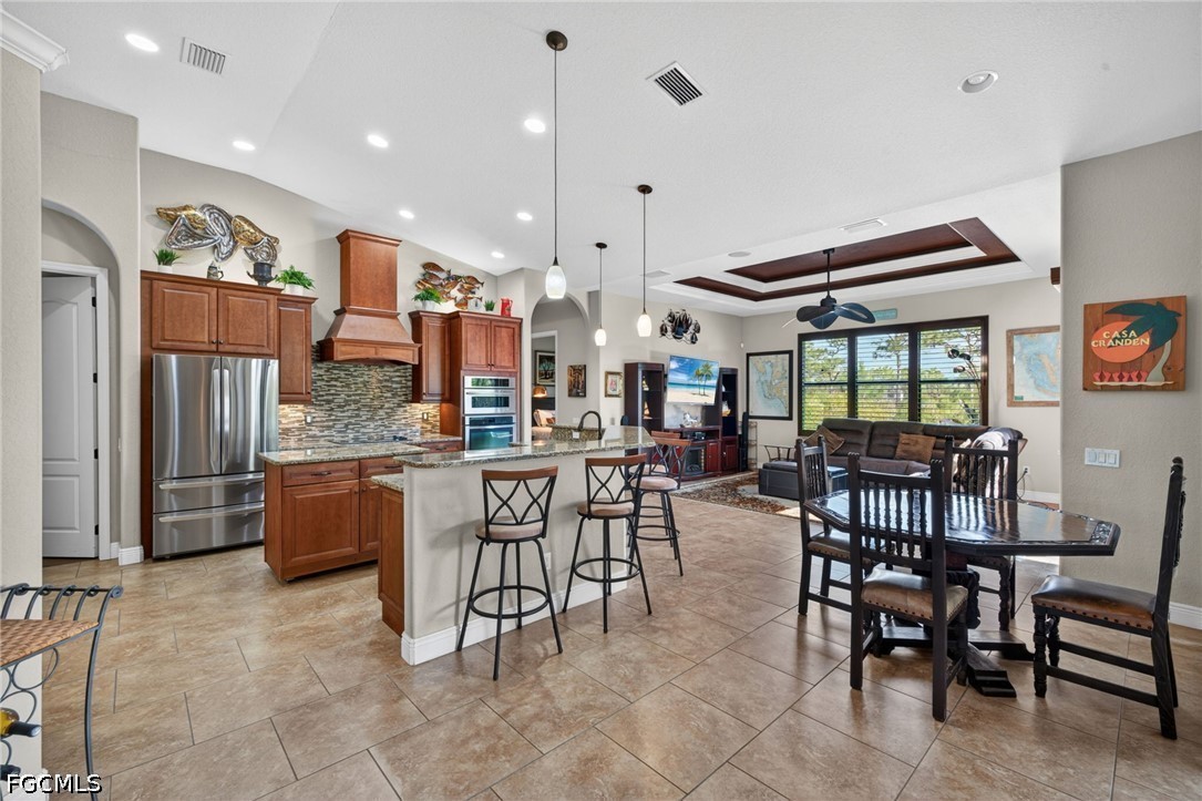 6109 Calusa Rdg Trail Bokeelia, FL 33922 - Photo 16 of 48 a large kitchen with a table and chairs