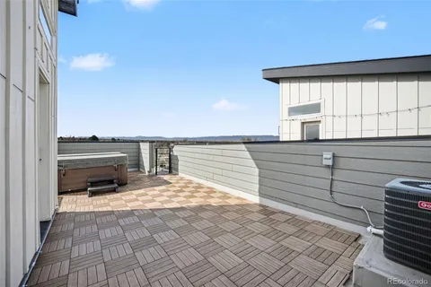 a view of a kitchen with wooden floor and a sink