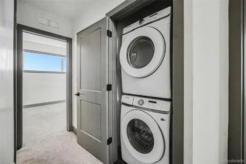 a view of a storage & utility room with washer and dryer