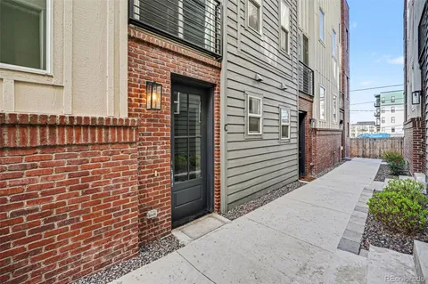 a view of a brick house with a small space