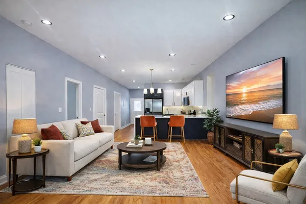 a living room with furniture and a flat screen tv