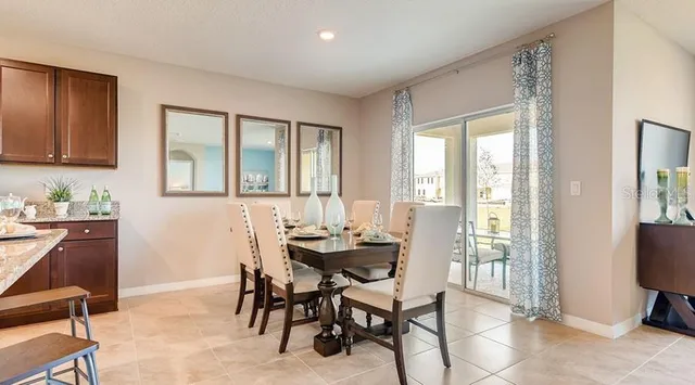 a dining room with furniture and window