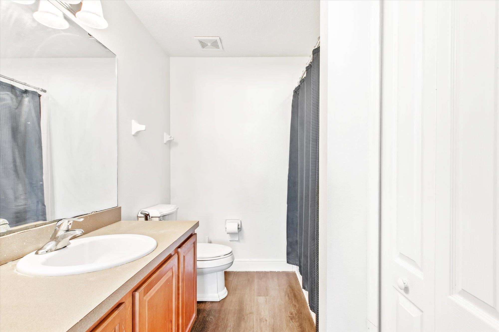 653 Drake Bay Terrace St. Augustine, FL 32084 - Photo 15 of 32 a bathroom with a sink and a mirror