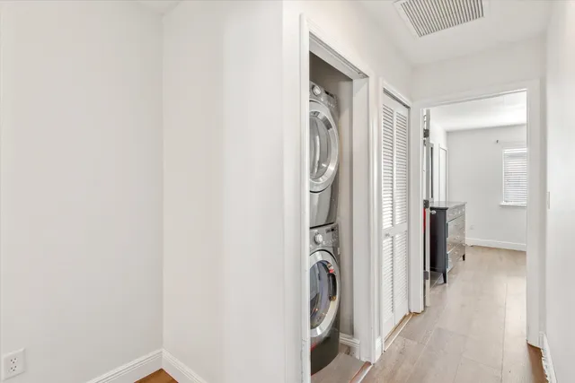 a view of a storage & utility room with a washer dryer