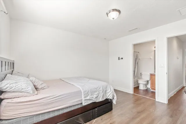 a bedroom with a bed and a walk in closet