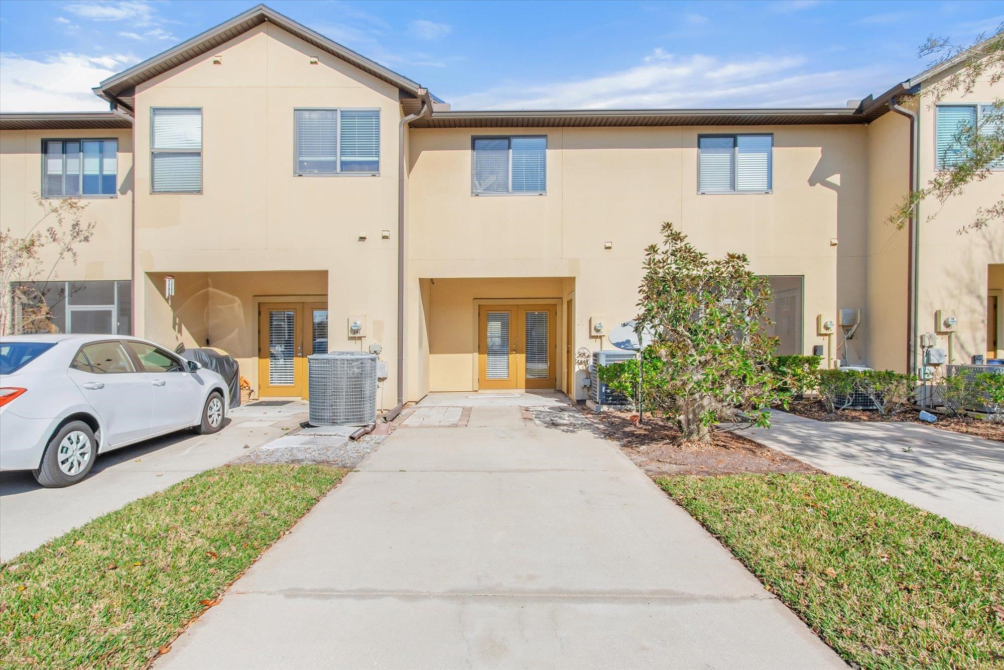 653 Drake Bay Terrace St. Augustine, FL 32084 - Photo 24 of 32 a front view of a house with garden