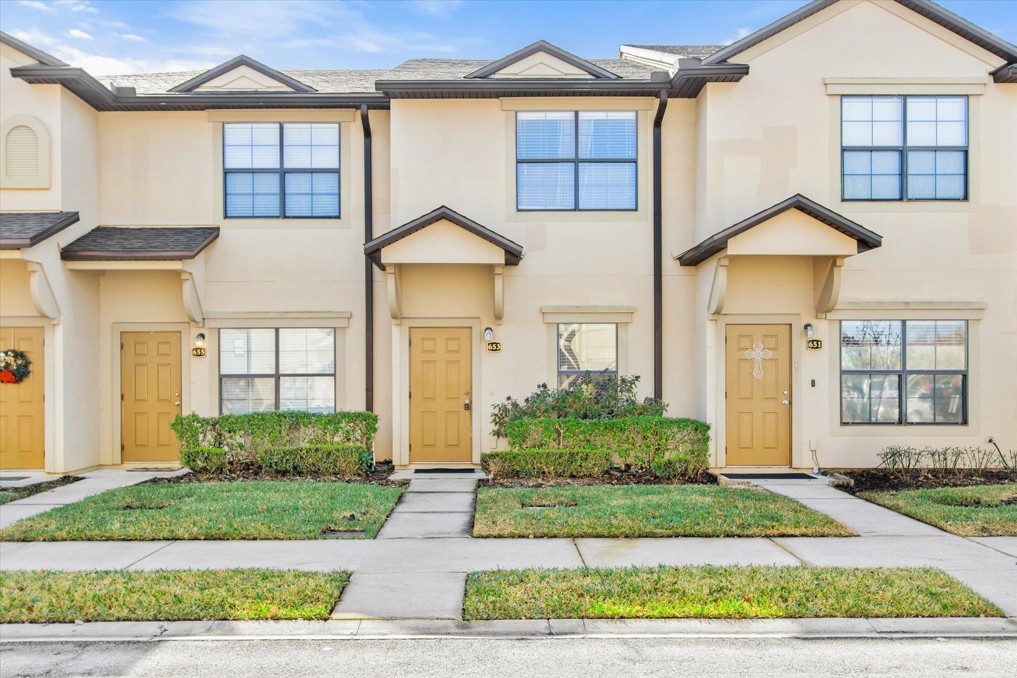653 Drake Bay Terrace St. Augustine, FL 32084 - Photo 25 of 32 a front view of a house with garden