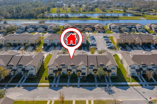 an aerial view of residential houses with outdoor space