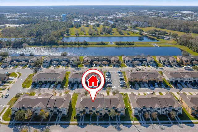 an aerial view of a houses with outdoor space and city view